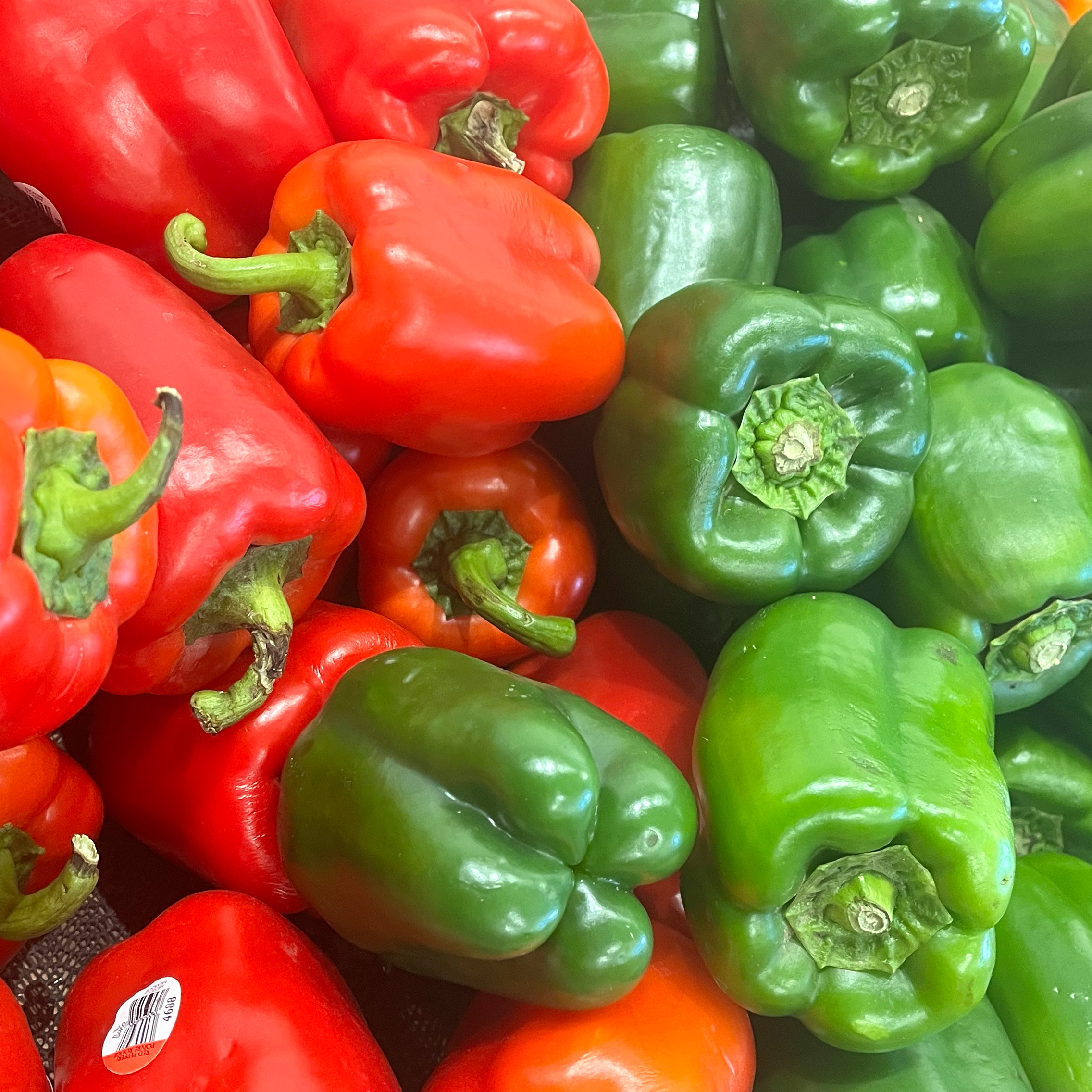 Green and red peppers on display.